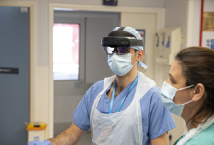 Clinician wearing a Microsoft HoloLens 2 headset during a clinical teaching session at Great Western Hospitals